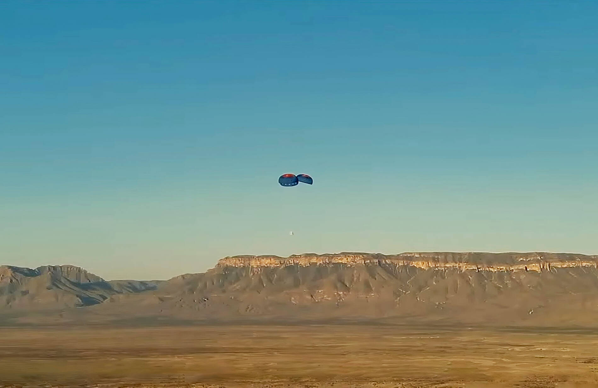 Kent-based Blue Origin’s New Shepard crew capsule descends Aug. 3 in West Texas. COURTESY PHOTO, Blue Origin