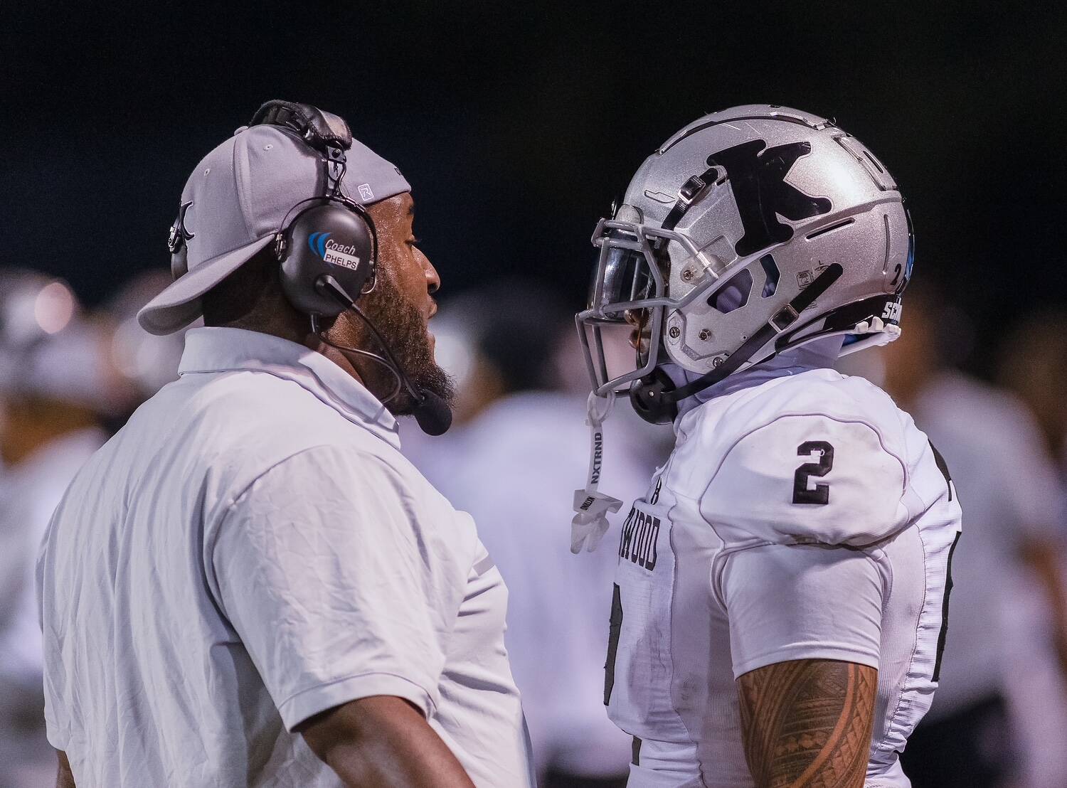 Photos provided by Robby Mullikin
New Kentwood Coach Quincey Davidson Jr. and a Kentwood player on the sidelines.