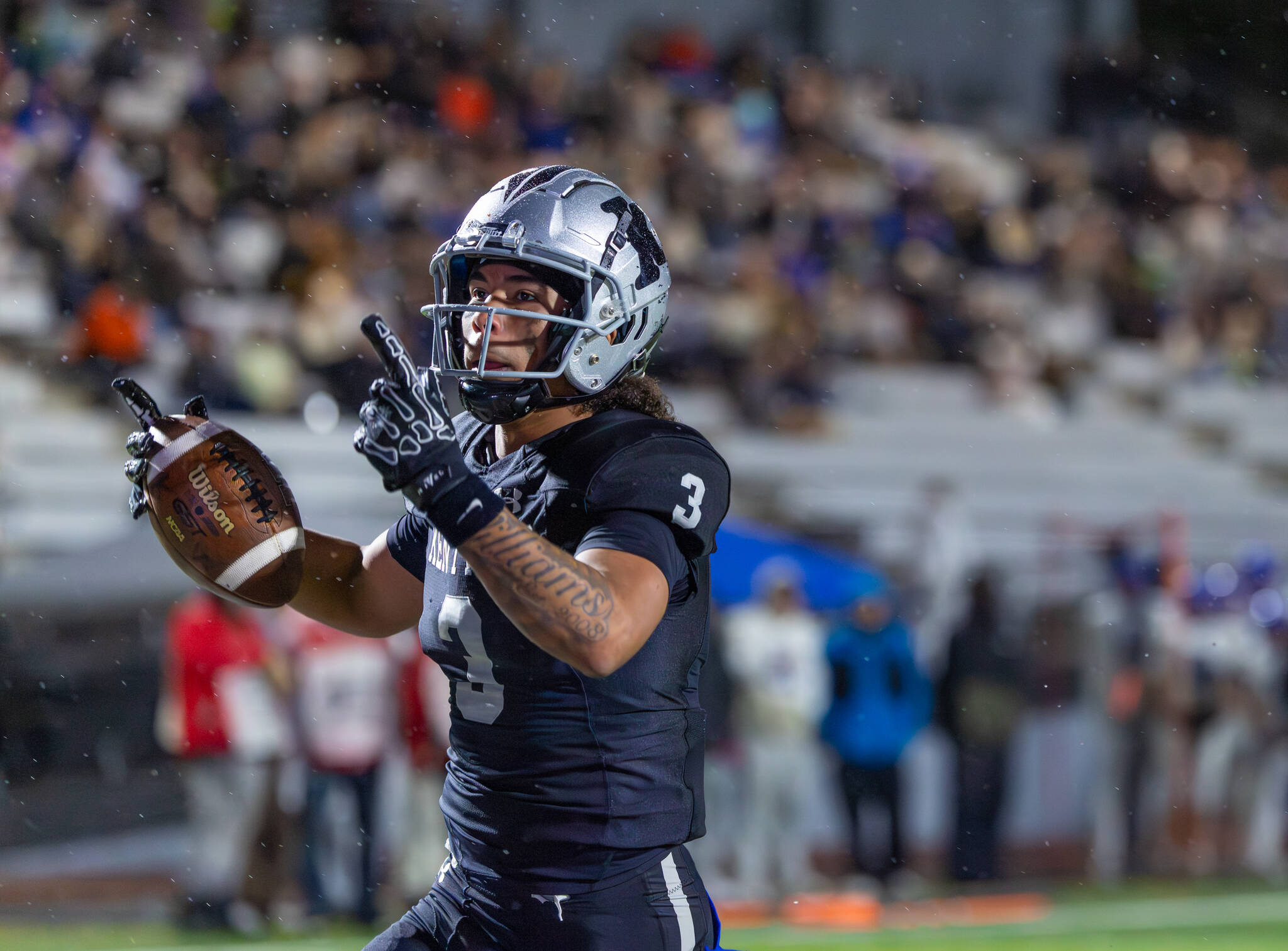 On his third touchdown of the night, Darian Williams points to the sky. Photo by Robby Mullikin
