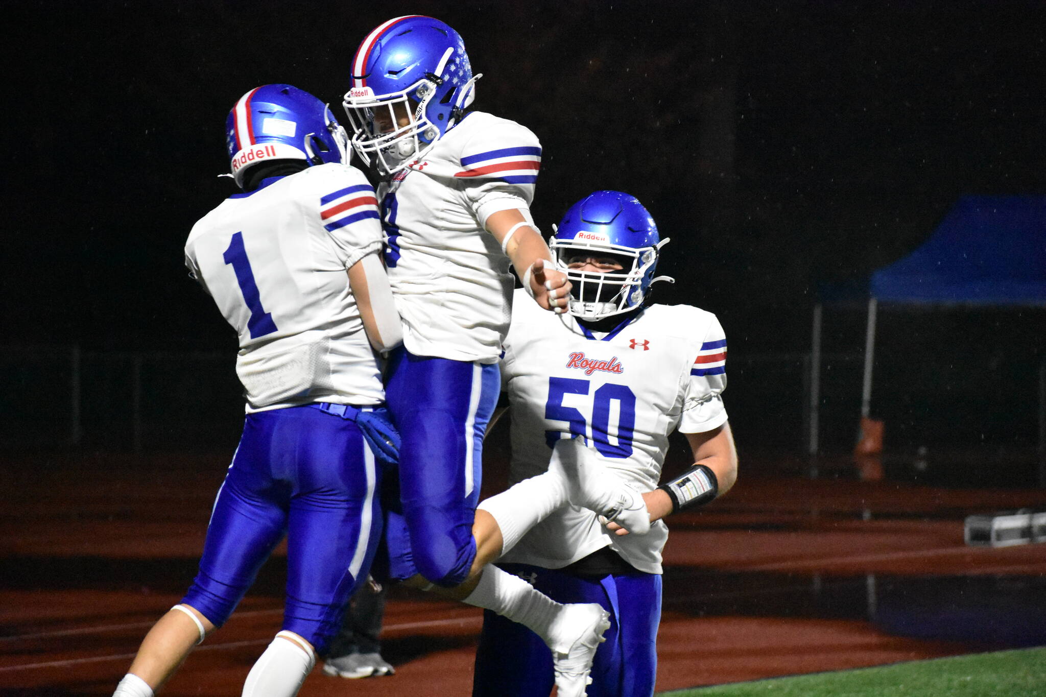 Adonai Garza and Luke Garza celebrate a touchdown for Kent-Meridian. Ben Ray / The Reporter