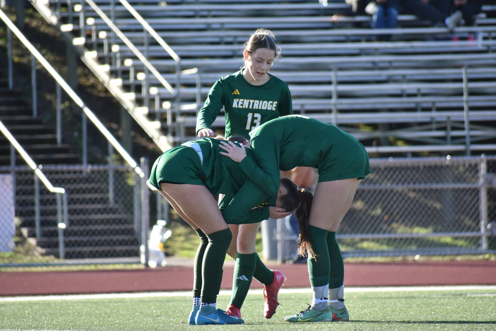 Kentridge players console one another after falling to Emerald Ridge. Ben Ray / The Reporter