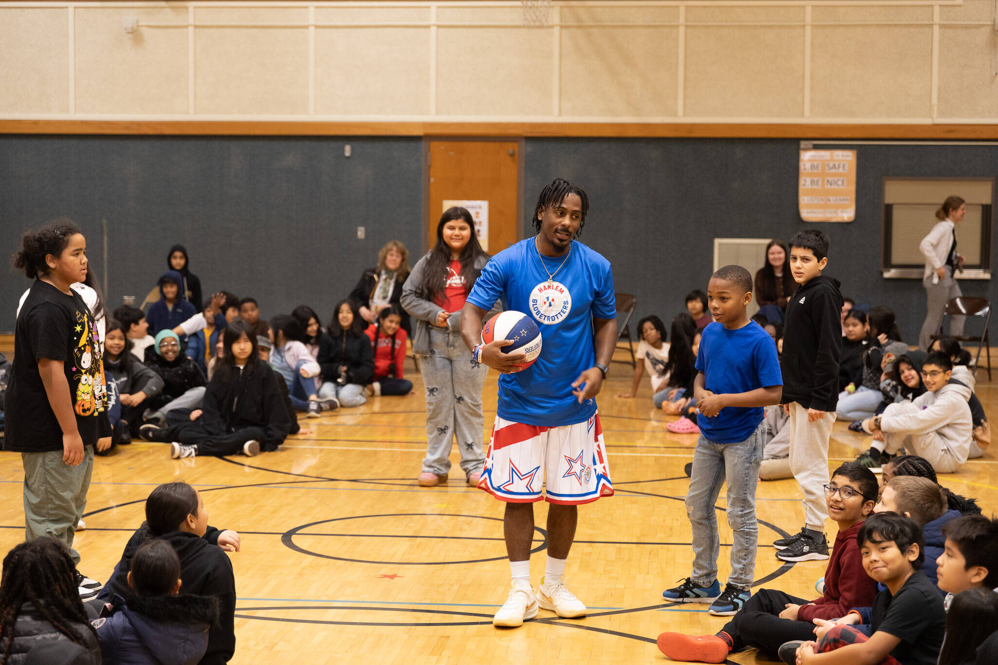 On Nov. 6, “Too Tall” Winston of the Harlem Globetrotters visited students at East Hill Elementary School in Kent. The visit was coordinated by the accesso ShoWare Center, which is hosting the Globetrotters on Jan. 30, 2026, during their 100 Year Tour. The show includes the popular gravity-defying dunks and game-changing tricks, along with pre-game and post-game fun. Tickets can be purchased at accessoshowarecenter.com. COURTESY PHOTOS