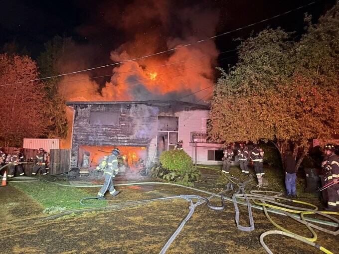 Photo of the home on fire. Courtesy of Puget Sound Fire