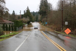 Jones Road near Cedar River has water of the roadway and filling people’s homes from the record-breaking flood. Photo by Bailey Jo Josie/Sound Publishing.