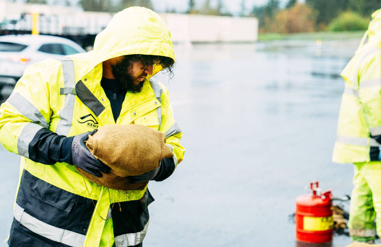 A city Public Works crew member places a sandbag early in the week of Dec. 15. COURTESY PHOTO, City of Kent