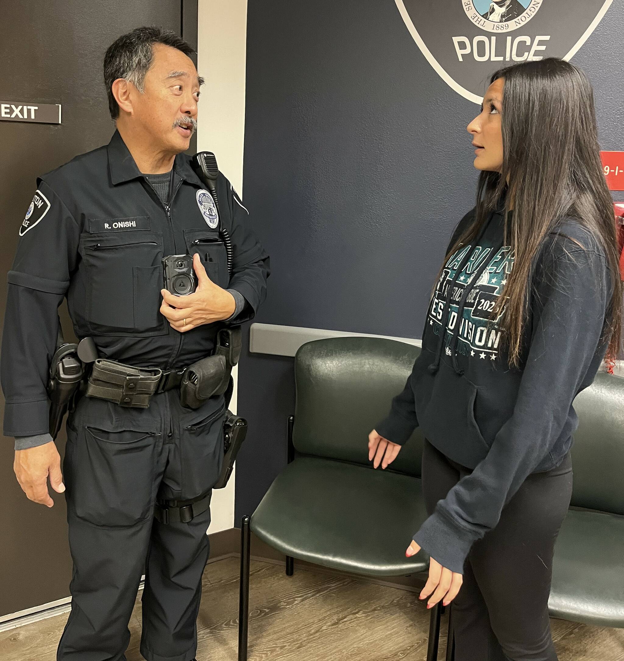 Renton Officer Robert Onishi is using the new technology in his body cam to translate while speaking with a non-English speaker in a demonstration. Photo provided by the Renton Police Department