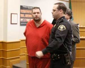 Vincent Housley stares out into the gallery as he is escorted out of the courtroom by the bailiff in an earlier court hearing Feb. 18.