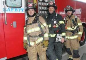 Kent firefighters have taken a 3 percent pay cut to help the city save money and avoid layoffs. Pictured are city firefighters Tom Johnson