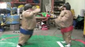 Kent Reporter staffers Brian Beckley and Brandon Carr duke it out in sumo suits at Clowns Unlimited in Kent.