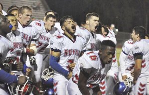 Kent-Meridian High players celebrate after delivering a 41-36