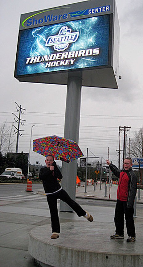 Jessica and Justin Plett pose for their father's Greg Plett's entry in the ShoWare Center marquee contest. Plett won the contest with this photo and will receive two tickets per month to a ShoWare Center event for one year.