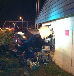 A resident escaped injury despite a car crashing into a Kent apartment Sunday morning on the West Hill.