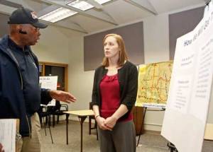 City of Kent Parks Planner Lydia Moorehead talks with Kent resident Larry Tukes