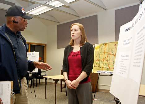 City of Kent Parks Planner Lydia Moorehead talks with Kent resident Larry Tukes