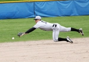 Kentwood shortstop Bryant Van Engeleburg can't quite reach a single stroked into left field by Tahoma's Cory Ferguson during the fourth inning of Wednesday afternoon's game. Tahoma beat Kentwood