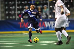 Stars midfielder Raphael Cox pushes the ball forward against Dallas during MASL play Sunday at the ShoWare Center.