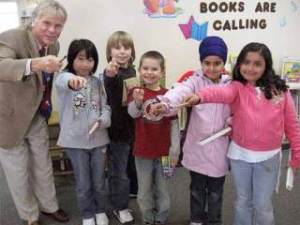 Students from from East Hill Elementary including; Aimee Phung; 8; Ben Fredell; 8; Skyler Hanson; 7; Jagroop Kaur; 7; and Cynthis Herrera-Rodriguez; seen here with principal Kyle Good; will have their work displayed in downtown Kent through March 20 as part of the 15th annual student art walk.