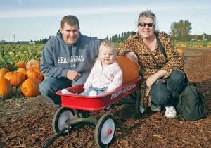 Dennis and Jennifer Weigel of Auburn wheel their daughter Grace