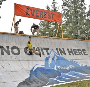 A participant jumps to scale “Everest