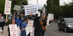 Medical marijuana supporters gather in June before a Kent City Council meeting to protest the city's ban against medical marijuana collective gardens. A King County Superior Court judge upheld that ban on Oct. 5.