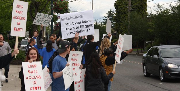 Medical marijuana supporters gather in June before a Kent City Council meeting to protest the city's ban against medical marijuana collective gardens. A King County Superior Court judge upheld that ban on Oct. 5.