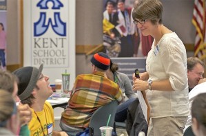 Lynn Lofstrom pauses to talk to Kentridge science teacher Matthew Czajka during a bi-monthly classroom workshop for new teachers in the district. While many districts offer similar mentorship programs
