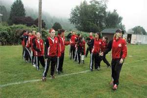 Kent Youth Soccer League Coach Deb Tulloch preps her team before a 2008 game at the Pea Patch soccer fields. The popular location could be closing.