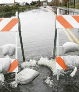 The Kent City Council approved an increase in storm-drainage rates to help pay for capital improvement projects to control flooding. Shown above is water from Mill Creek flooding 76th Avenue South in Kent on Nov. 7.