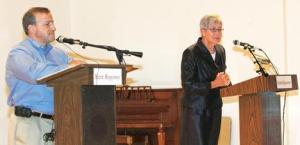 Jim Berrios and Suzette Cooke answer questions at the Kent Reporter Debate Forum Oct. 19 at the Kent Senior Activity Center. Berrios is challenging incumbent Cooke for the city's top position.