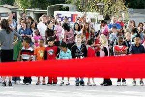 Students are shown waiting Sept. 15 for the brand-new Panther Lake Elementary to open its doors. The elementary had an official ribbon-cutting ceremony and bell-ringing celebration to herald its opening. Due to fluctuations in the student population