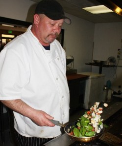 Kurt Mikel prepares a breakfast order Tuesday morning at the Yukon Grill in Kent. The restaurant is owned and operated by three Mikel brothers.