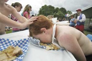 Brian Dye of Kent gets a little help staying engaged from his cousin