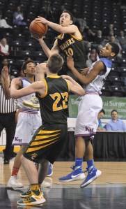 Kentridge's Matt Mcvicker goes up for a shot against the Kent-Meridian defense during the Les Schwab Kent Shootout on Thursday night.