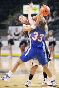 The only thing slowing down Kentlake’s Morganne Comstock was Kent-Meridian’s Melanie Vertrees (No. 33). Comstock led the Falcons past the Royals with 21 points.