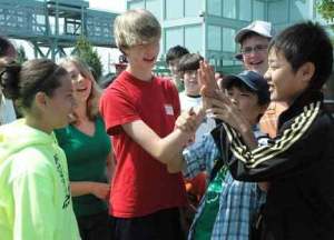Auburn student Colton Johnson engages in a handshake of sorts Tuesday with Tamba