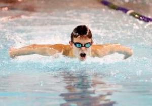 Creating his own wake: Kentridge’s Cameron Whiting parts the water during the 100 butterfly last week during a South Puget Sound League North Division dual against Auburn Riverside. Whiting won the event