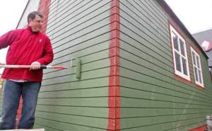Kent Station General Manager John Hinds paints Santa’s Workshop Friday to prepare for the holiday season at Kent Station.
