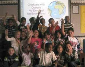 The students of K K Young’s class at Scenic Hill Elementary smile as they participate last month in their school’s Graduate With Options Program. They are
