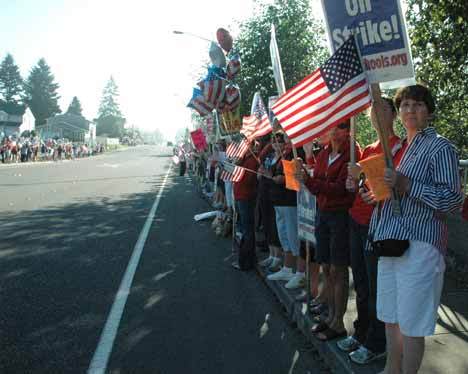Striking teachers again lined the roadway outside Kent School District headquarters Friday