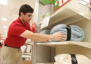 Target employee David Snodgrass restocks an empty end cap at Kent's Target.  Snodgrass restocked this shelf nearly 10 times by 1 p.m. on Black Friday.