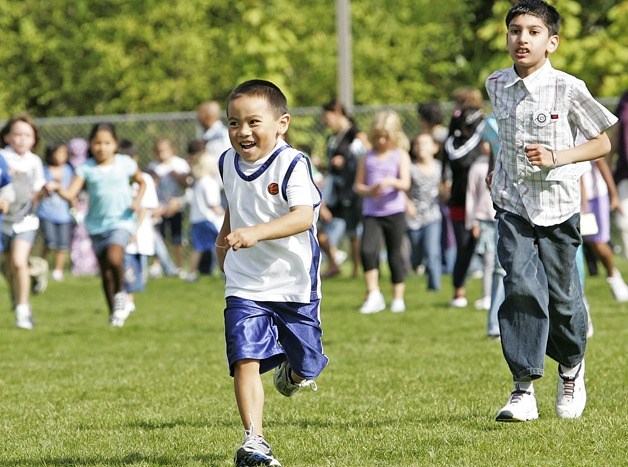 Emerald Park kindergartner Tobey Rivera runs with a big smile