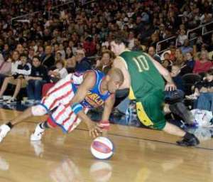 Harlem Globetrotter Scooter Christensen displays his dribbling skills.