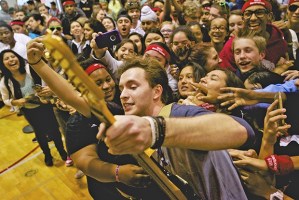 Country music singer Dakota Bradley leans in for a photo with Kentwood students during his concert at the High School Nation assembly Sept. 25. The event provided students with the chance to get acquainted with music and art tools.