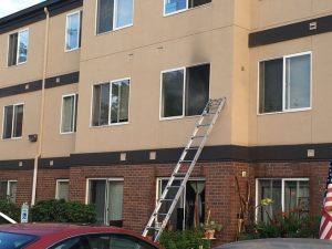 Kent Police rescued a woman from a second-story apartment fire on Monday in the 24500 block of 64th Avenue South.