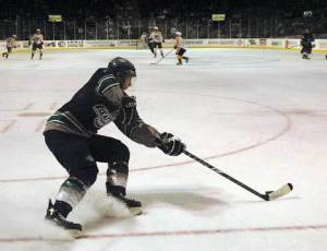 Thunderbird Erik Fleming moves the puck out of the T-Bird zone Friday night versus the Brandon Wheat Kings at the ShoWare Center in Kent. The Wheat Kings took the contest 4-1.