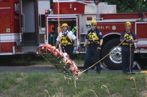 Kent firefighters rescue a man from the Green River on Tuesday