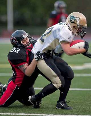 The Majestics' Jasmine Arriola (82) hauls down a Sacramento Sirens player Saturday at Kent Field. The Majestics took the contest against their rivals 33-8.
