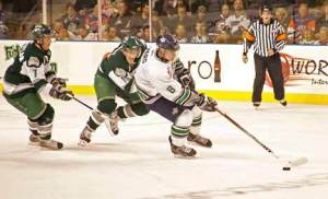Thunderbirds defender Stefan Warg (in white) holds his own against Everett at the ShoWare Center last season. The City of Kent's new stadium has earned a coveted Gold award from the U.S. Green Building Council for its environmentally friendly design and construction.