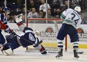 The Thunderbirds' Connor Sanvido fires a shot at Tri-City goalie Troy Trombley.