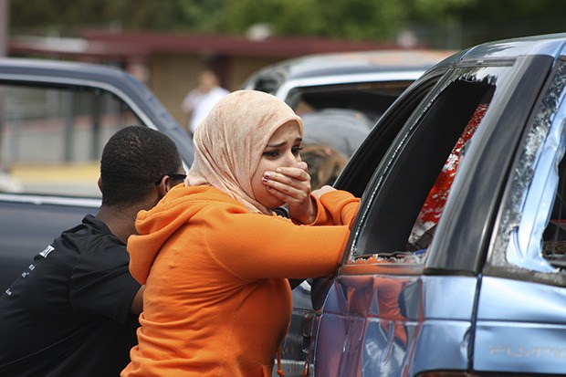Simulated shock: Hannah Madani acts distraught with other student leaders during a simulated car crash scene as part of the Gift of Life simulation present by the Kent Fire Department.